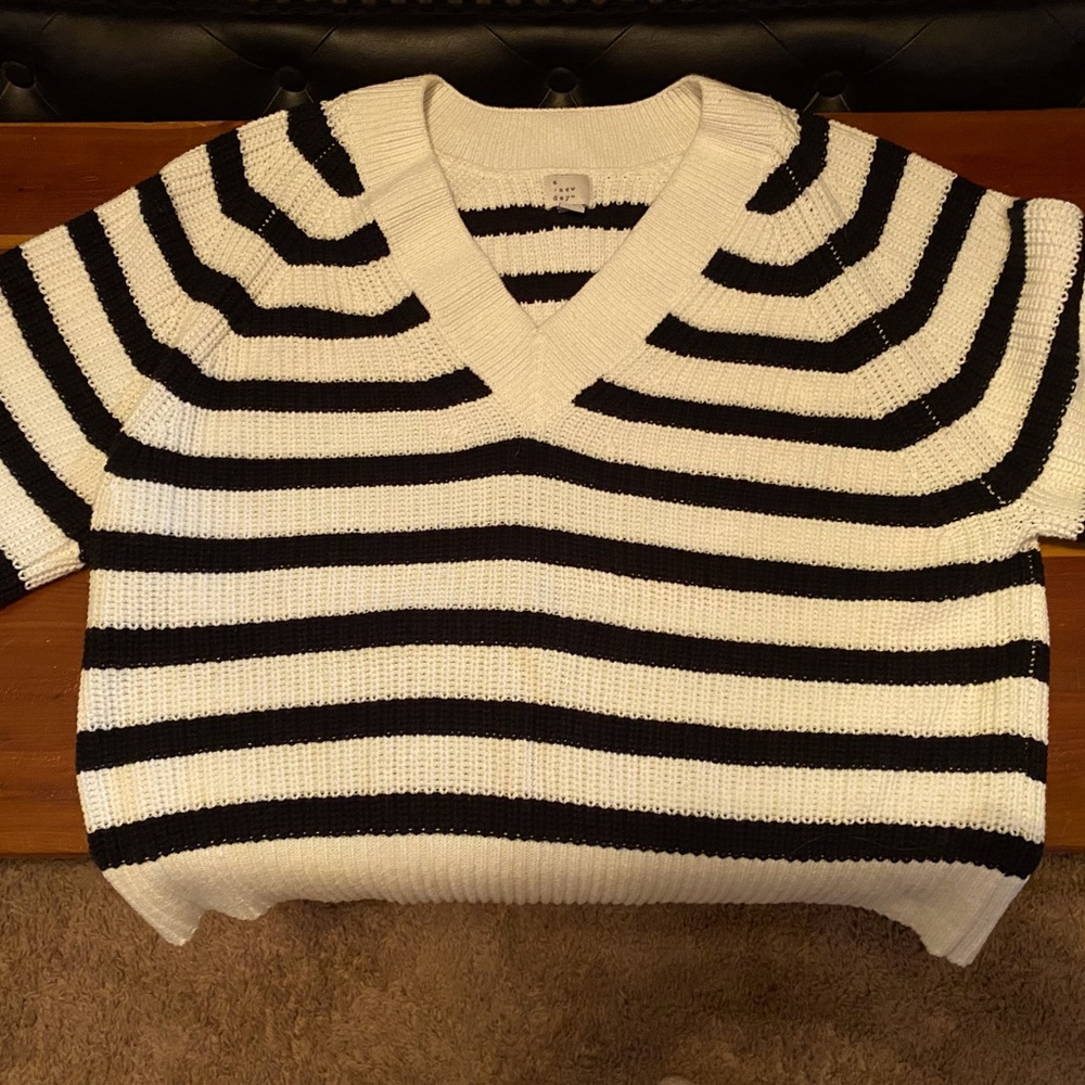 Black and cream pullover sweater.
